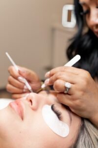 Lash technician working on hybrid lash extensions for a client at LashLuv Beauty Bar, Bothell WA – serving Woodinville, Lynnwood, and surrounding areas