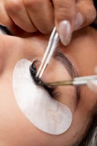 Close-up of esthetician applying volume lash extensions at LashLuv Beauty Bar in Bothell WA – trusted by clients from Kenmore and Kirkland