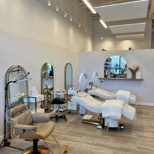 Left-side view of LashLuv Beauty Bar treatment area in Bothell WA, with esthetician performing a lash service β serving Kenmore, Woodinville, and Mill Creek
