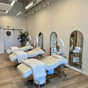 Right-side view of service beds at LashLuv Beauty Bar in Bothell WA, featuring an esthetician mid-treatment β trusted by clients from surrounding areas like Kirkland and Lynnwood