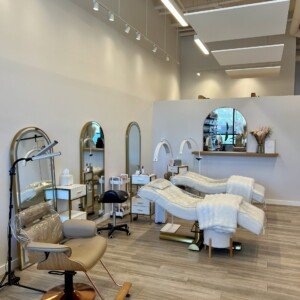 Left-side view of LashLuv Beauty Bar treatment area in Bothell WA, with esthetician performing a lash service β serving Kenmore, Woodinville, and Mill Creek