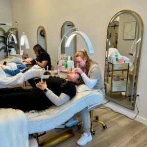 Two estheticians shaping and tinting brows and lashes inside LashLuv Beauty Barβs Bothell WA studio β proudly serving clients from Kenmore, Mill Creek, and Woodinville